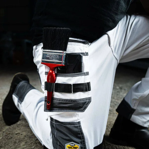Rebel tech gear arctic white closeup on pocket and paint brush 600x600 1.jpg
