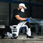 Rebel tech gear arctic white kneeled down and spraying 600x600 1.jpg