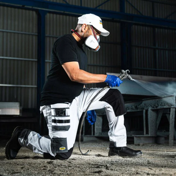 Rebel tech gear arctic white kneeled down and spraying 600x600 1.jpg